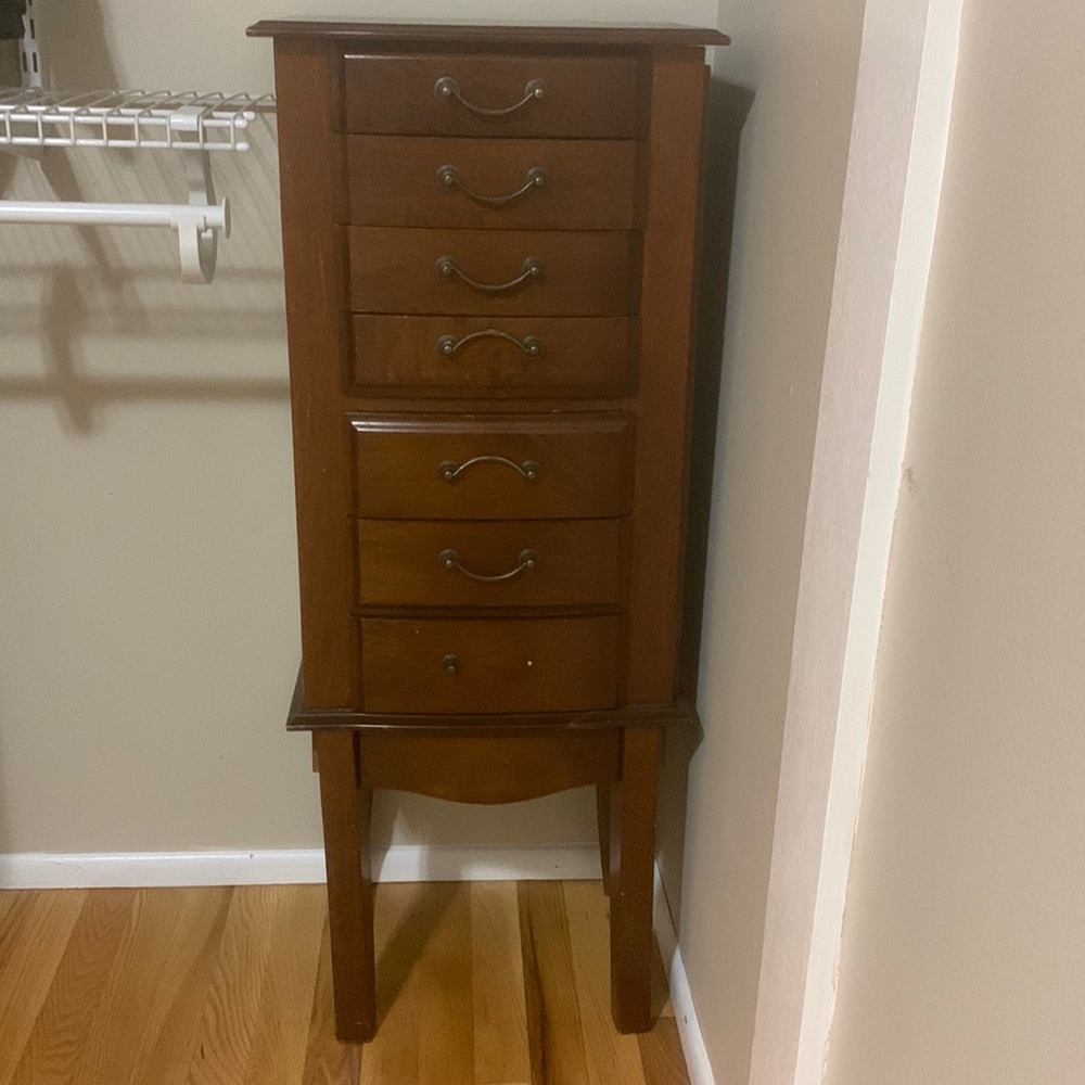 Jewelry Box with drawers and hanging necklace doors .